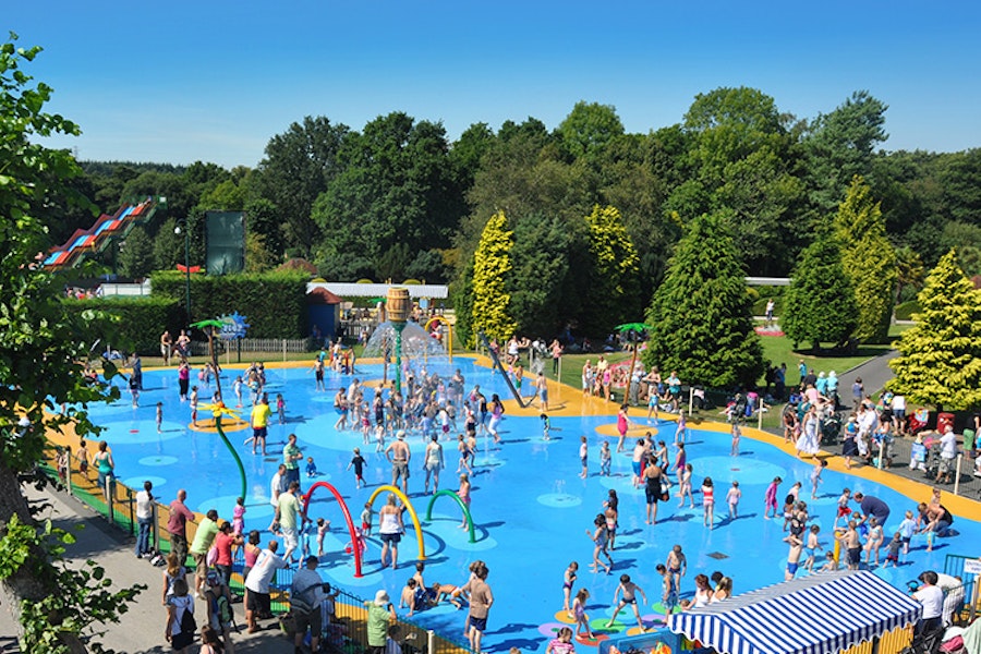 Children playing in a water splash area at Paultons Park