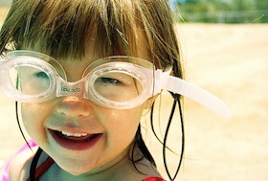 Little girl with swimming googles on