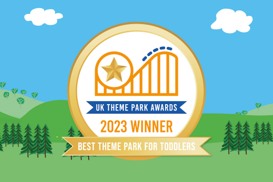 Badge for 'UK Theme Park Awards 2023 Winner' for 'Best Theme Park for Toddlers' with a star and rollercoaster graphic against a green hill and blue sky background.