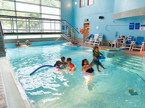 Family enjoying a swimming pool during a Paultons Park short break