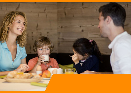 Family of 4 eating breakfast