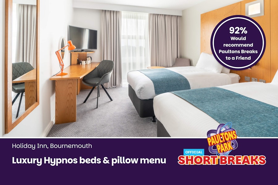 Hotel bar with wooden counter and Starbucks offer text about coffee availability.