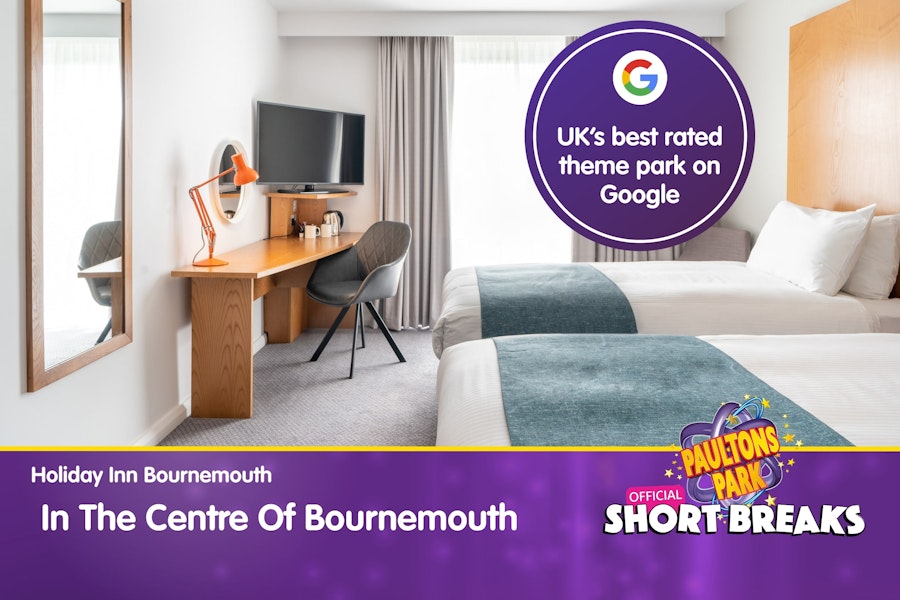 Bright hotel twin room with message highlighting central Bournemouth location.