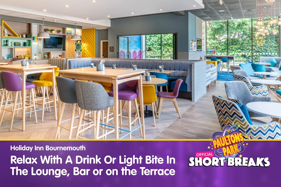 Modern lounge with colourful seating and text promoting drinks and light bites.