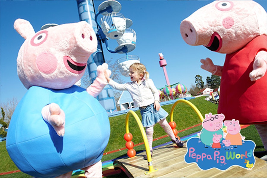 Little girl with Peppa Pig characters at Paultons Park